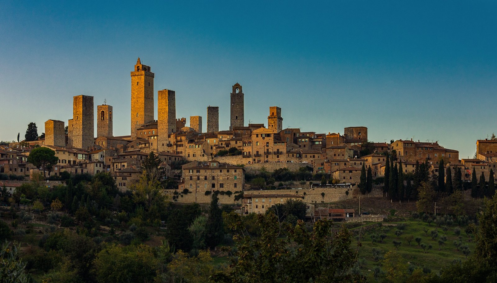 The medieval towers of San Gimignano, Tuscany, silhouetted at sunset